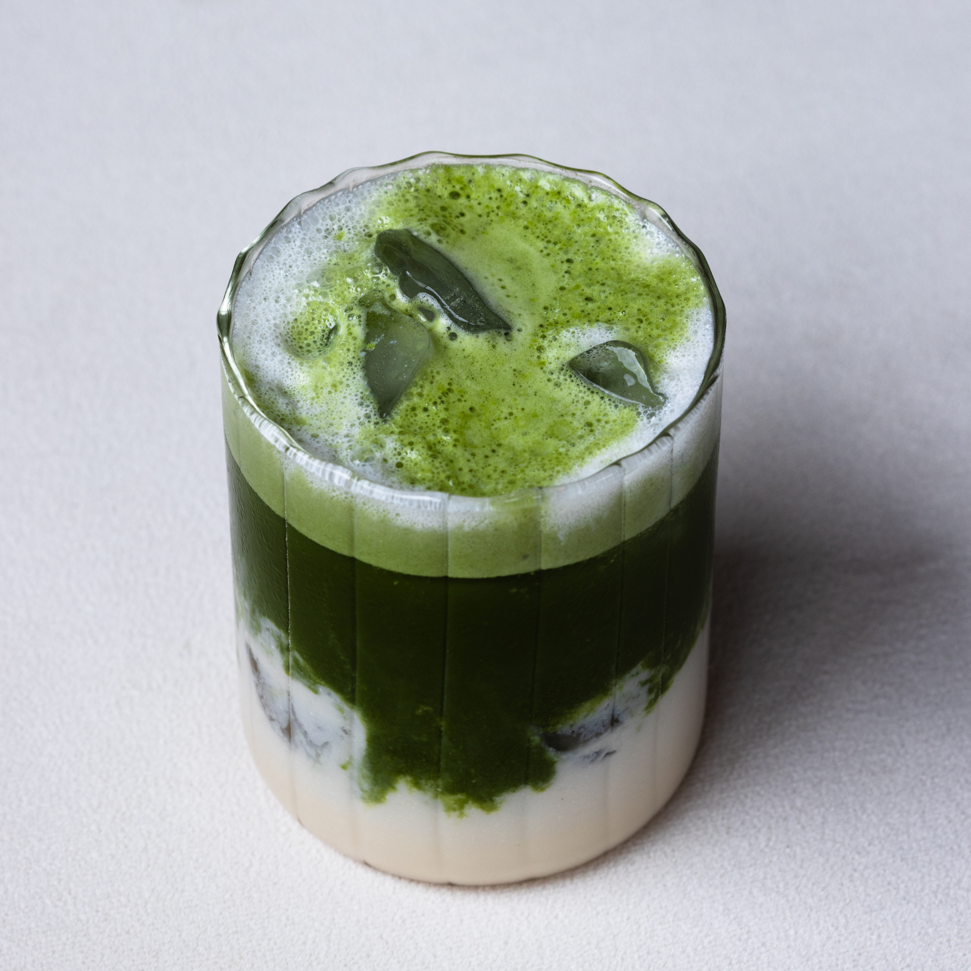 Matcha with ice cubes in a glass, Layered Iced Matcha
